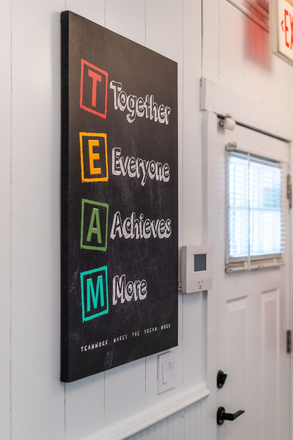 TEAM wall sign inside the Hilson Ink shop — Areas We Serve